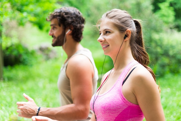 Couple running in a park. 