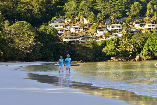 Couple running on tropical beach