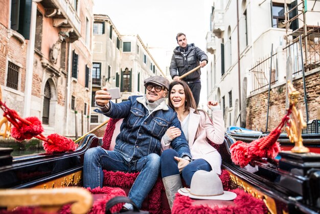 Couple sailing on venetian gondola