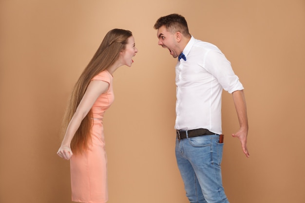 Couple screaming to each other family conflict