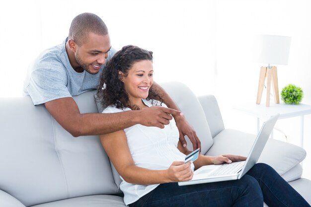 Couple shopping on laptop