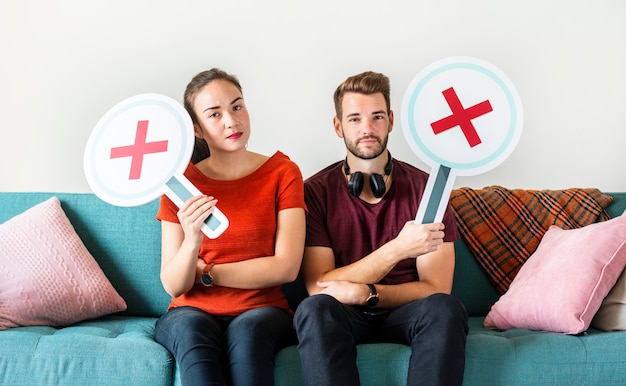 Couple showing wrong symbol sign