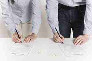 Photo couple signing divorce forms together high quality and resolution beautiful photo concept