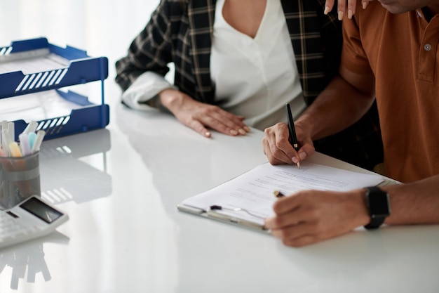 Couple Signing Document