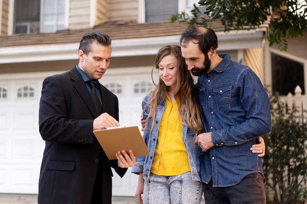 Couple signing papers fr new house