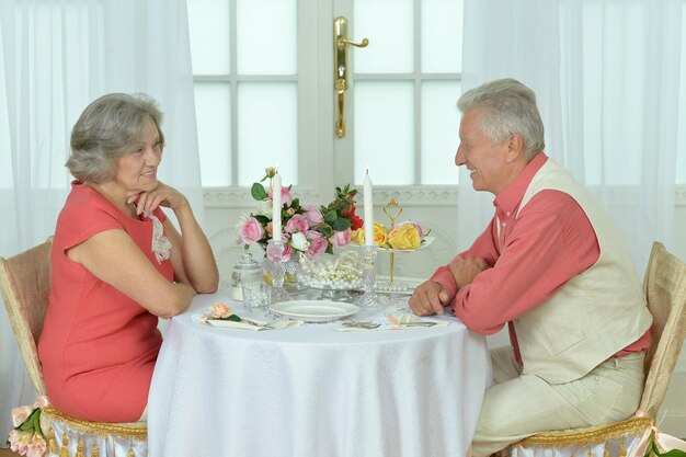 Couple sitting at dining table