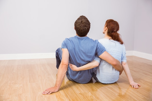 Couple sitting on floor together