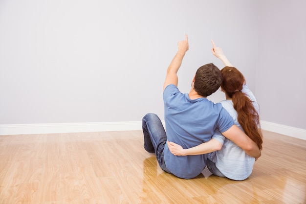 Couple sitting on floor together