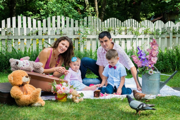 A couple sitting with the children