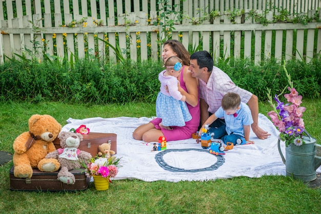 A couple sitting with the children