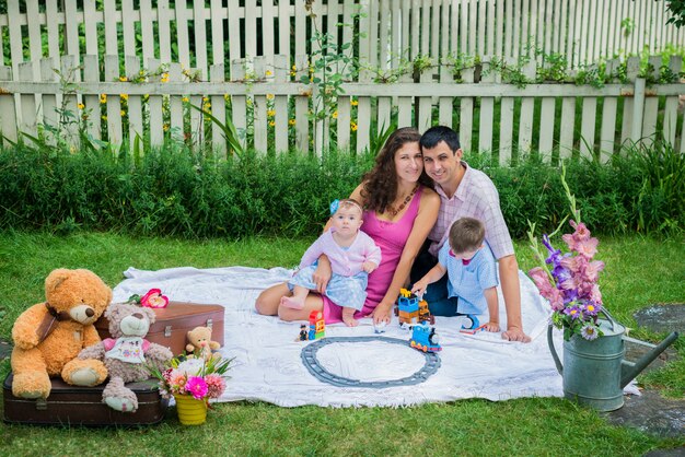 A couple sitting with the children