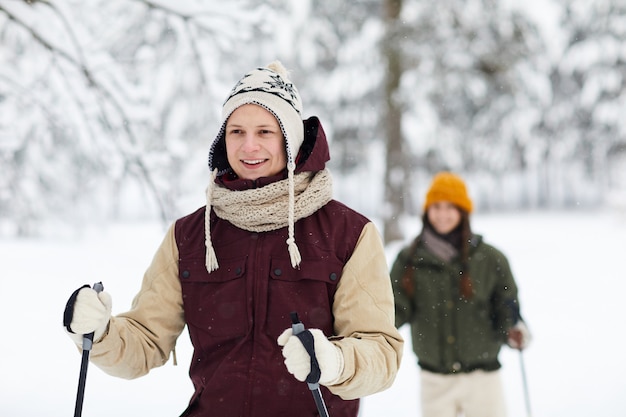 Couple Skiing in Forest