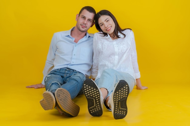 Couple smiling and sitting together on floor