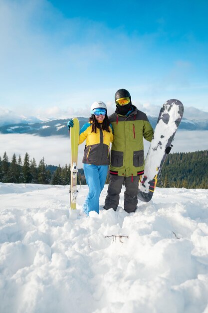 Couple snowboarder ans skier portrait