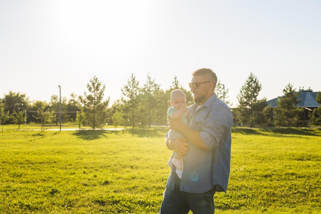 Couple standing on field against sky