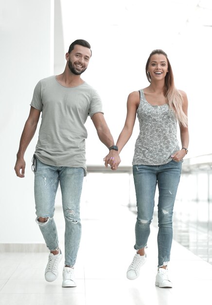 Couple standing in the lobby of a modern building