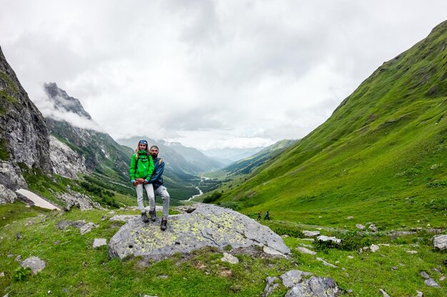 Couple standing on mountain