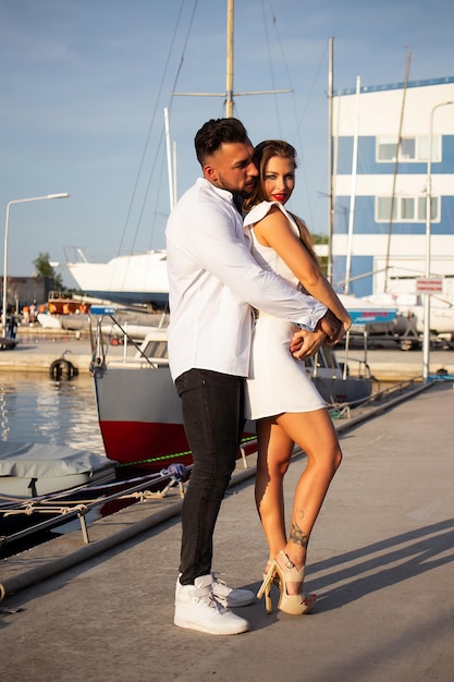 Couple standing in port in summer