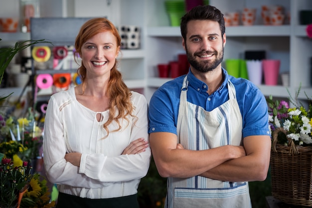 Couple standing with arms crossed