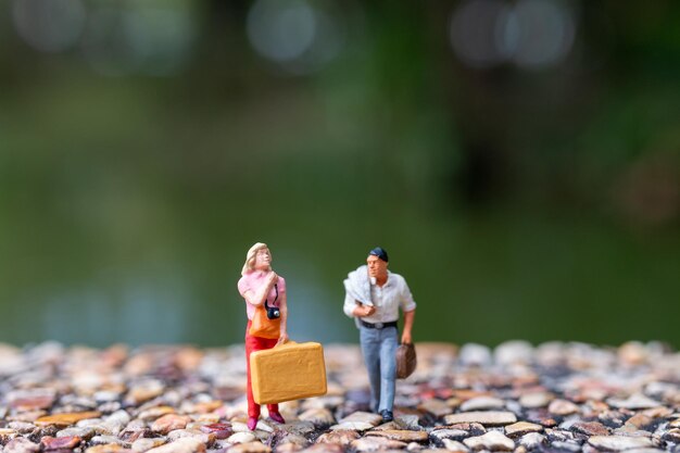 Couple strolling down the street has a background of greeneryxA