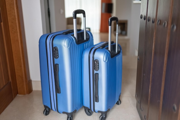 Couple of suitcases at the entrance of the holiday apartment to enjoy a few days of relaxation