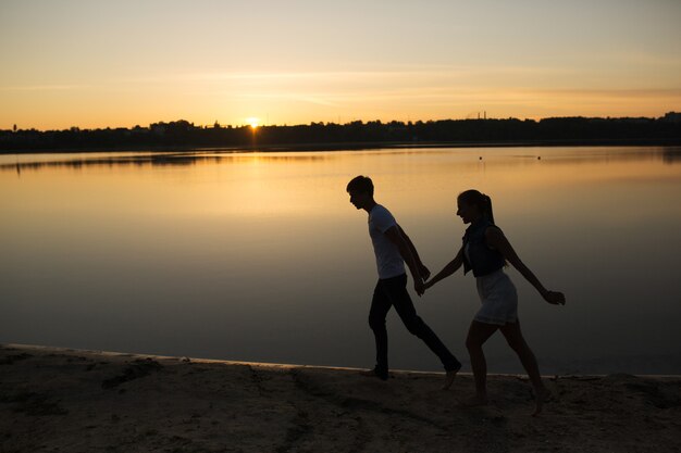 Couple in sunrise on the beach