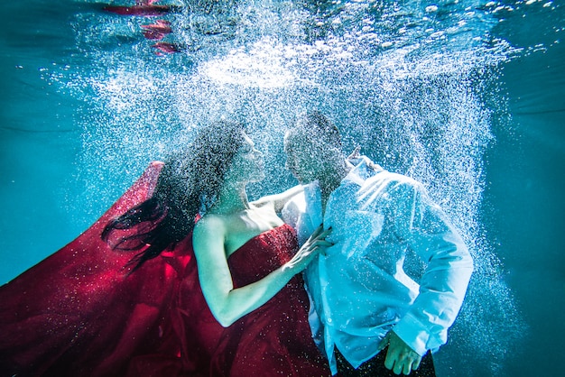 Couple swimming underwater