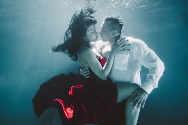 Couple swimming underwater