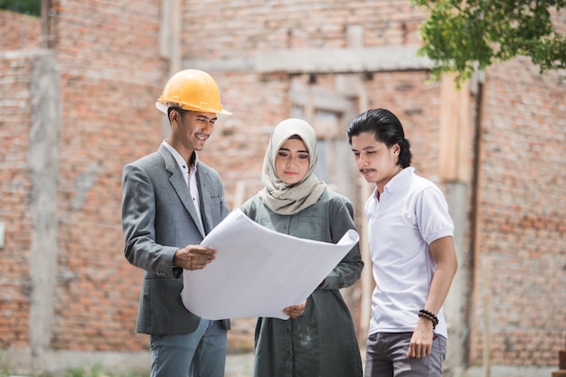 Couple take a look their house plan