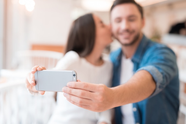 Couple Takes Selfie in Cafe Lady Gives a Kiss.