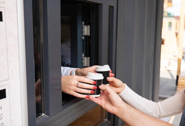 Couple takes takeaway coffee. Take a break from work and study and go outside.