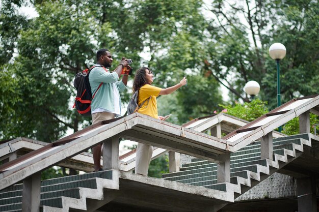 Couple taking pictures of urban scenes