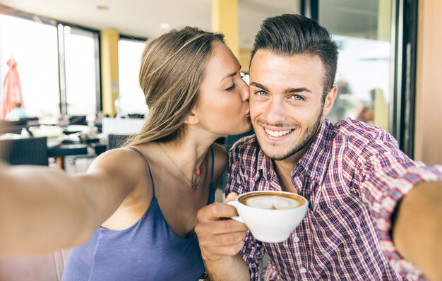 Couple taking selfie at breakfast time