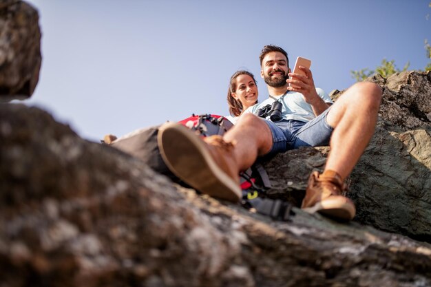 Couple taking selfie on mountain