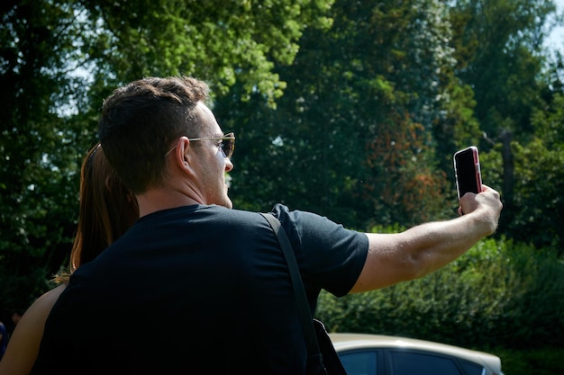 A couple taking a selfie in the park