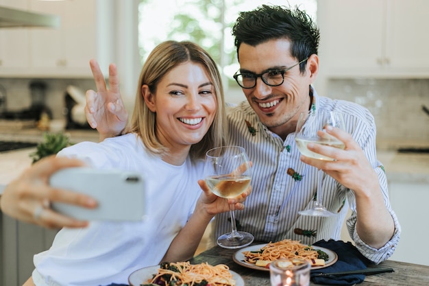 Couple taking a selfie during their dinner