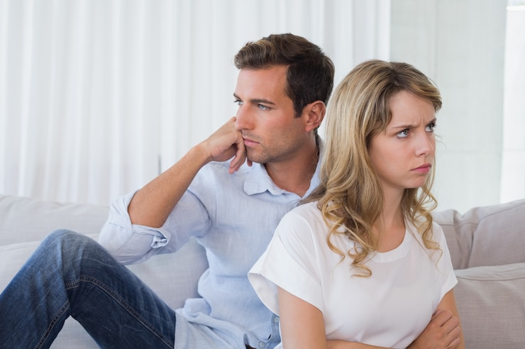 Photo couple not talking after an argument in living room