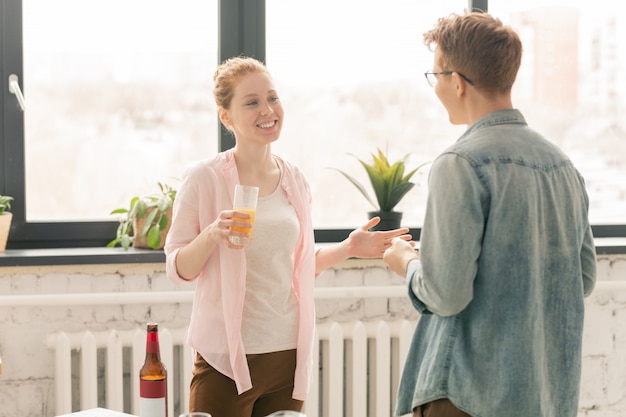 Couple talking at party