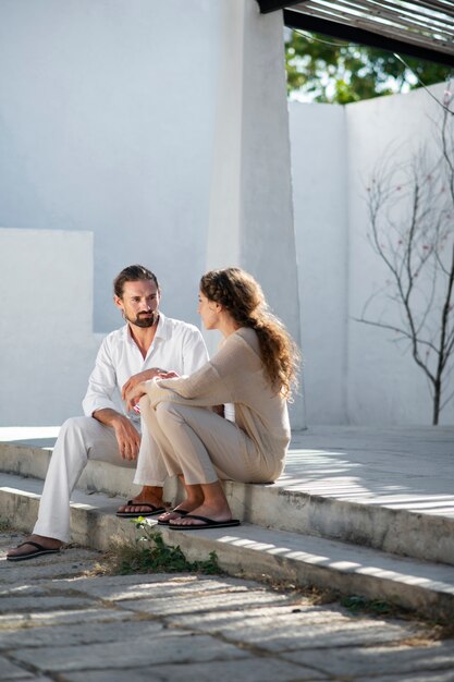 Couple talking and sitting outside during vacation