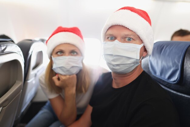 Couple tired of strong restrictions and need to wear face mask on board