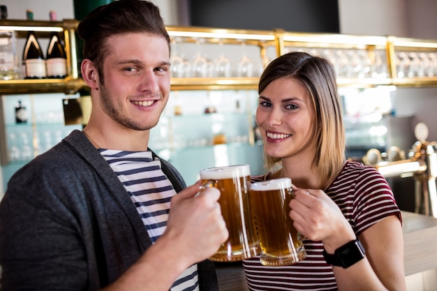 couple toasting beer mug