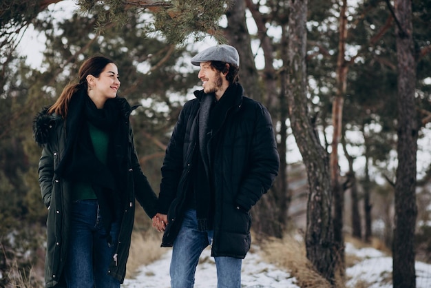 Couple together in winter park having fun