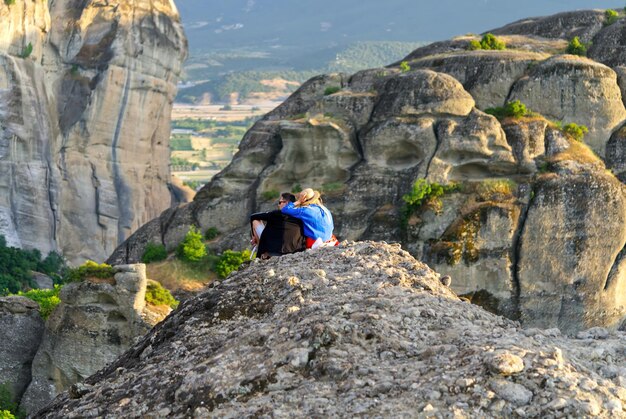 Couple on the Top of Mountain at Sunset Greece Meteora