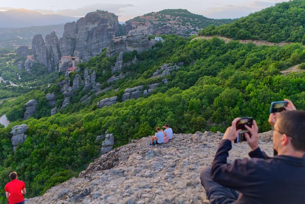 Couple on the Top of Mountain at Sunset Greece Meteora