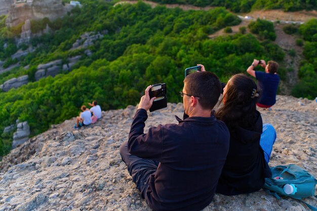 Couple on the Top of Mountain at Sunset Greece Meteora