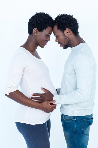 Couple touching head while standing 