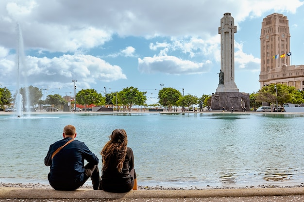 Couple of tourists on the square of Santa Cruz de Tenerife