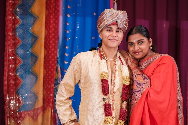 Couple in traditional costumes on the day of the ceremony Concept religion