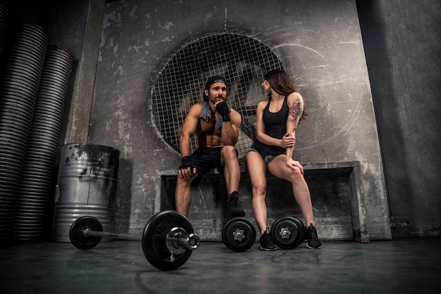 Couple training in a gym