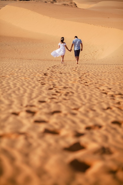 Couple travel sand dune. Sand and sky view